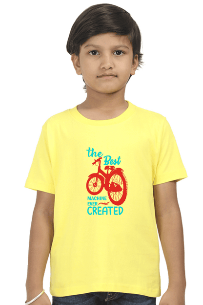 Boy wearing yellow The Best Machine Ever Created Kids Round Neck T-shirt with bike graphic illustration.