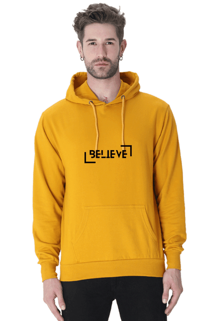 Unisex Believe Hooded Sweatshirt in vibrant yellow, providing warmth and style for winter wear.