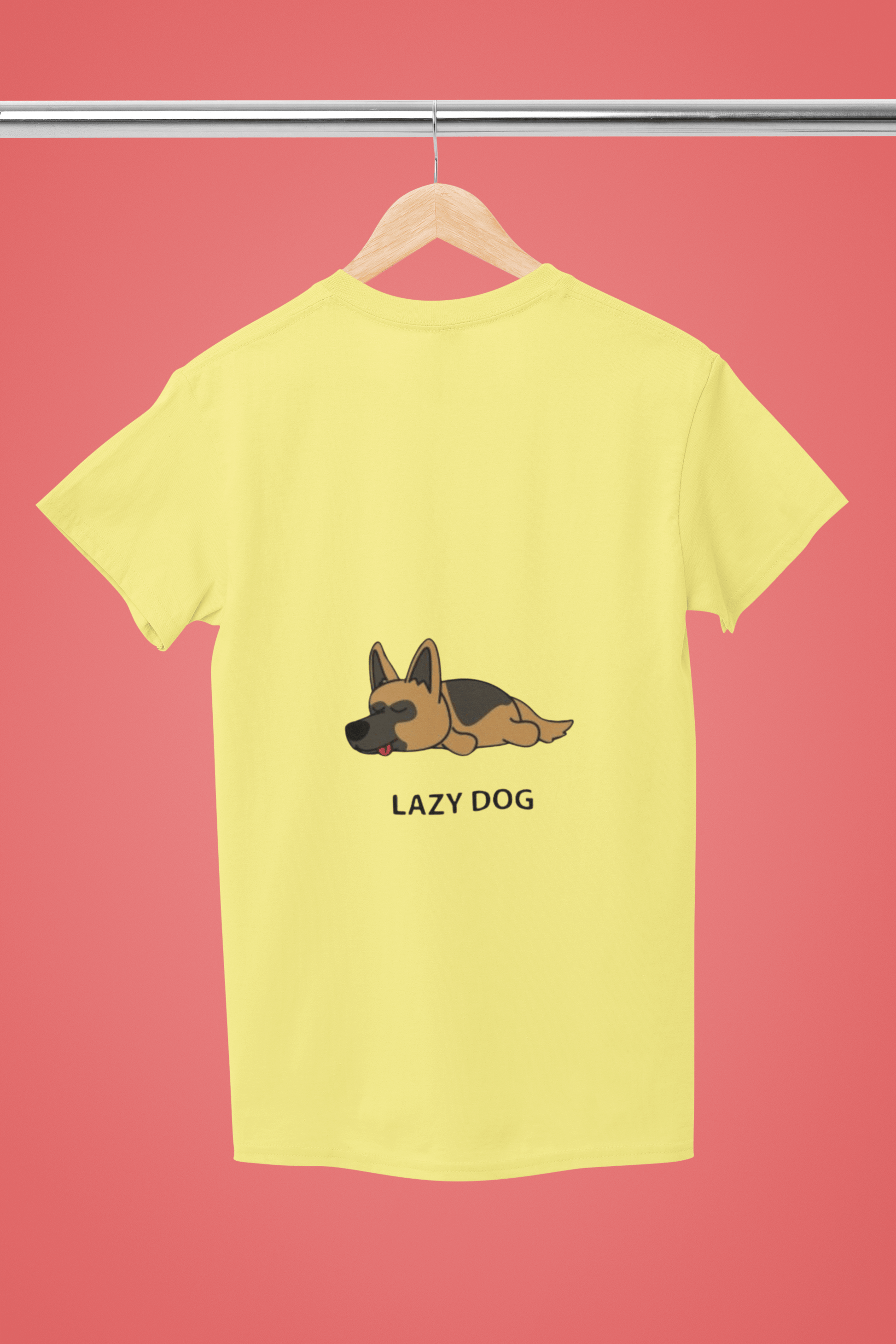 Yellow Lazy Dog Kids T-Shirt with cute dog illustration and durable double-stitched seams hanging on a wooden hanger against a pink background.