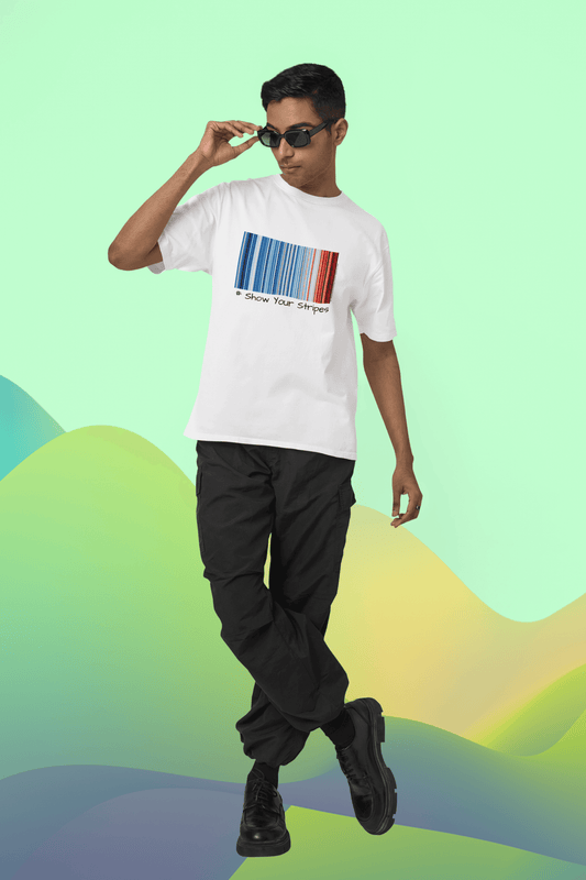 Man wearing "Show Your Stripes" t-shirt with warming stripe graphics depicting temperature changes in India, designed by Prof. Ed Hawkins.