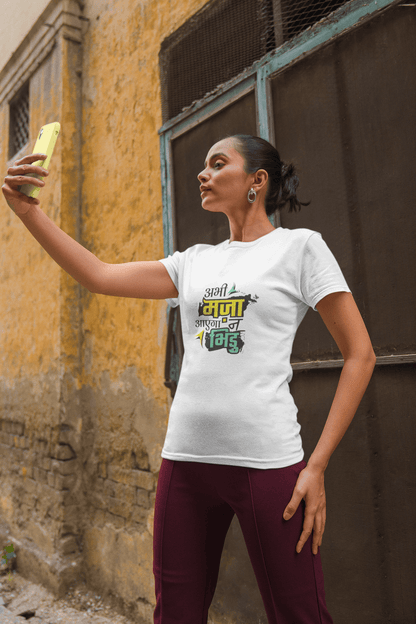 Woman wearing ABHI MAZA AAYEGA NA BHIDU unisex T-shirt taking a selfie