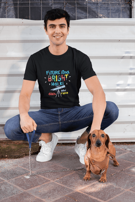 Man wearing a funky round neck t-shirt with a colorful design, sitting with a small dog, showcasing Future Bright tee in vibrant colors.